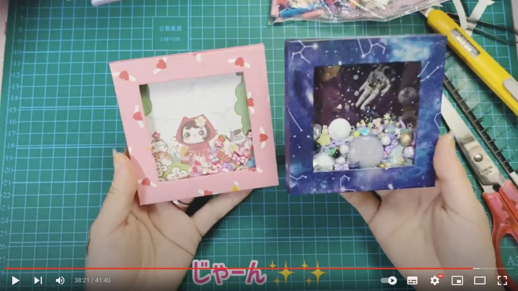 動画で作成した2種類のシェーカーが写っている写真。左のシェーカーはピンクの縁に猫のキャラクターの背景、右のシェーカーは星座模様の縁に宇宙飛行士が宇宙を漂っている背景です。