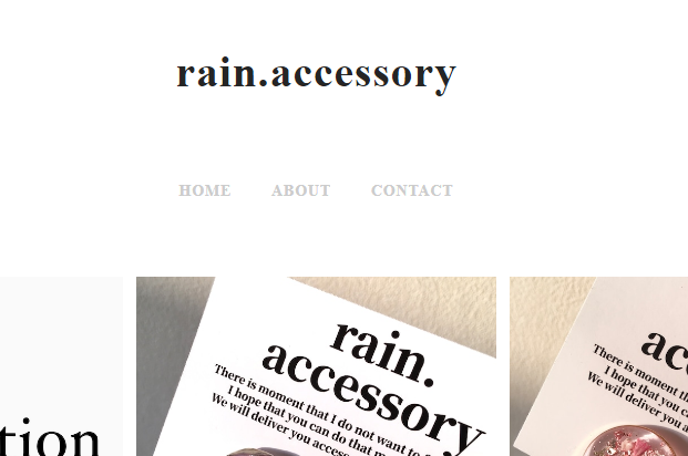 三間ゆう子さんのショップ「rain.accessory」のロゴ画像。白い背景に店名のみが浮かぶ、シンプルなデザイン。