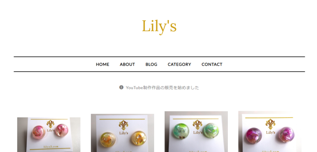 Lily'sのトップ画像。
Lily'sのロゴの下にカラフルなピアスが4つ並んでいる。左からピンク、黄色、グリーン、紫。