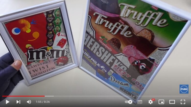カラフルなお菓子の色々なパッケージが、英字新聞にコラージュされて額装にしたものが二つ、画面の右と左に立てた状態で並んでいます。